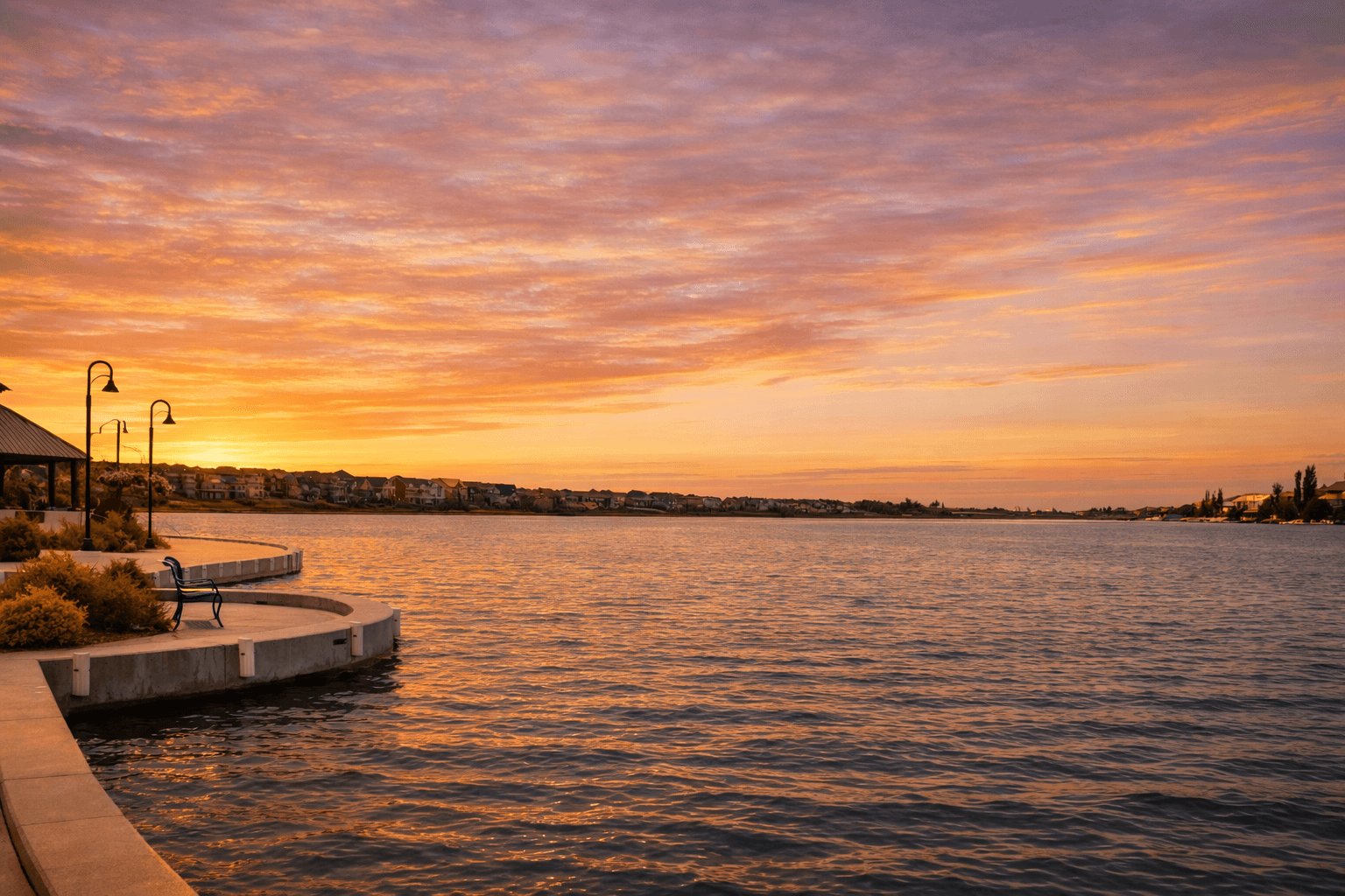 Chestermere lake shoreline at sunset.