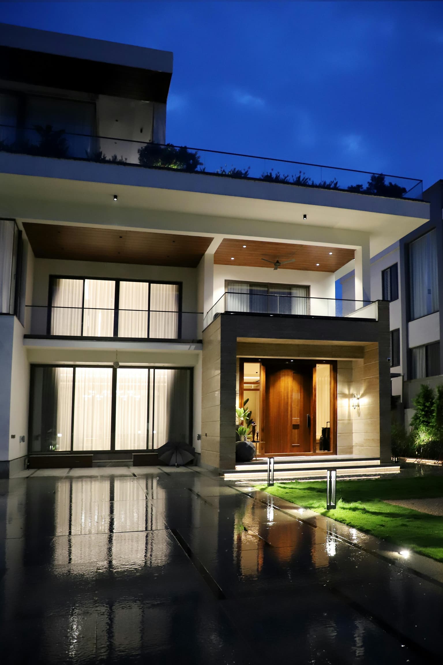 Modern luxury home exterior at dusk